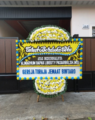 Papan Bunga Duka di Kosiwo